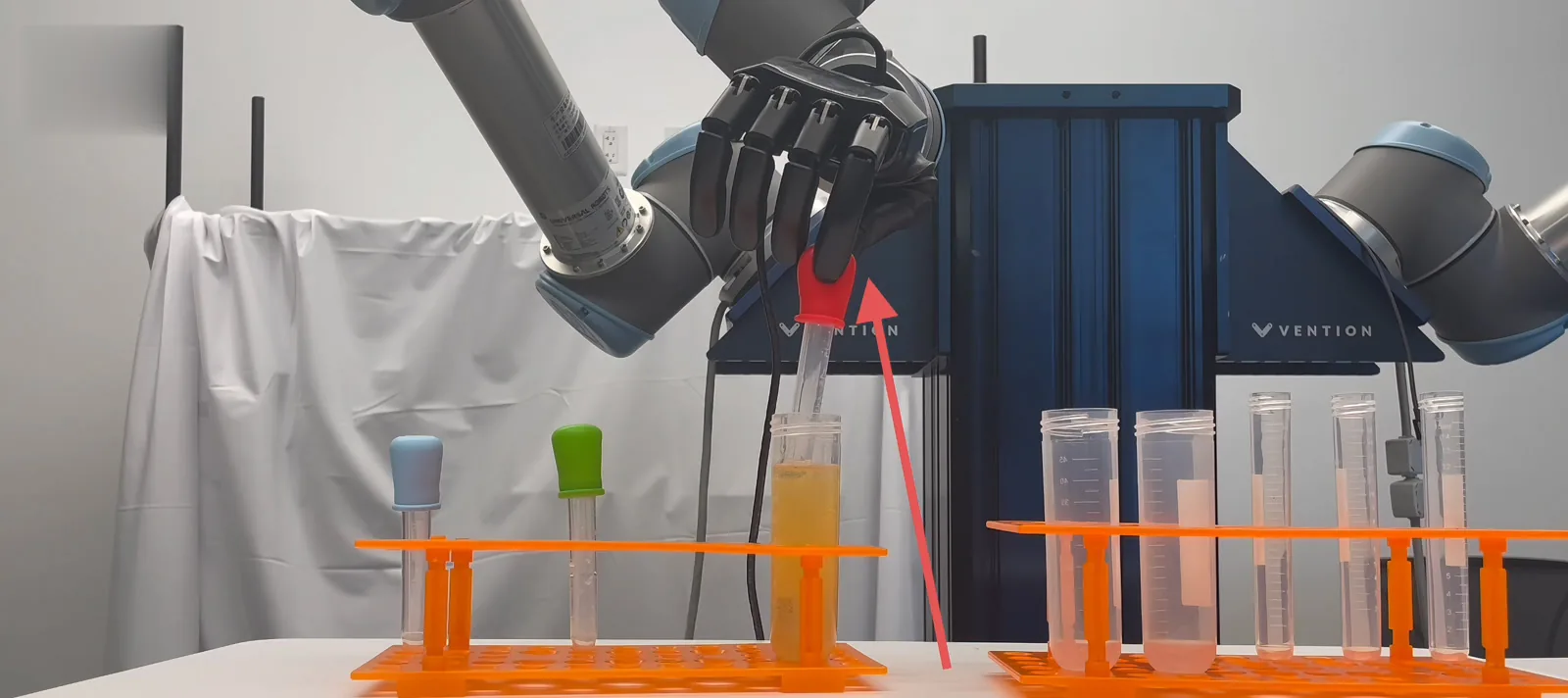 Dexterous robot hand handling a pipette with tactile feedback